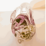 Pair of handmade apple blossom resin bunnies with preserved flowers inside