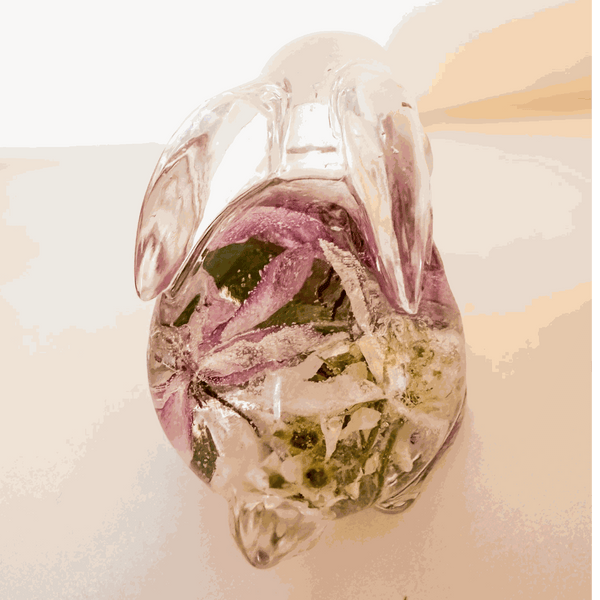 Pair of handmade apple blossom resin bunnies with preserved flowers inside