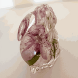 Pair of handmade apple blossom bunnies filled with preserved apple blossoms in clear resin decor
