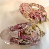 Pair of handmade apple blossom bunnies in clear resin with preserved flowers inside
