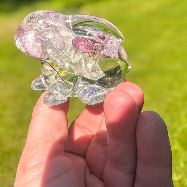 Two handmade apple blossom resin bunnies with real preserved flowers displayed as a matching pair
