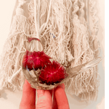 Handmade Crimson Meadow Songbird resin decor with real deep pink strawflowers and green fern inside