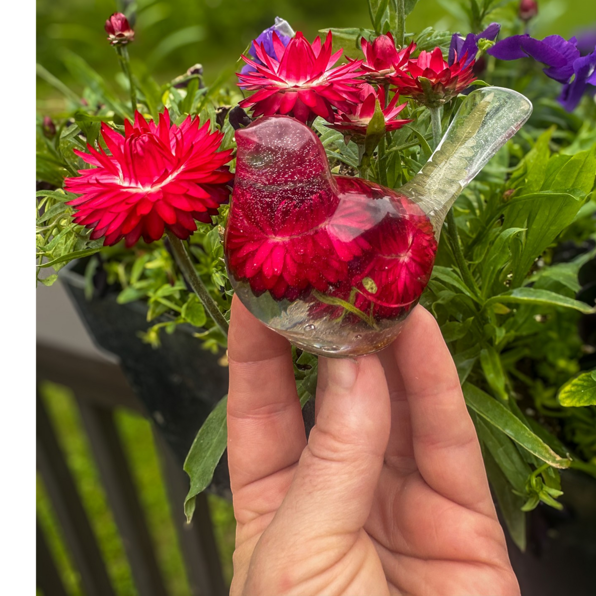 Crimson Meadow Songbird resin decor with preserved deep pink strawflowers and green fern handcrafted in clear resin