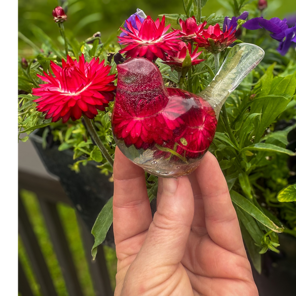 Crimson Meadow Songbird resin decor with preserved deep pink strawflowers and green fern handcrafted in clear resin
