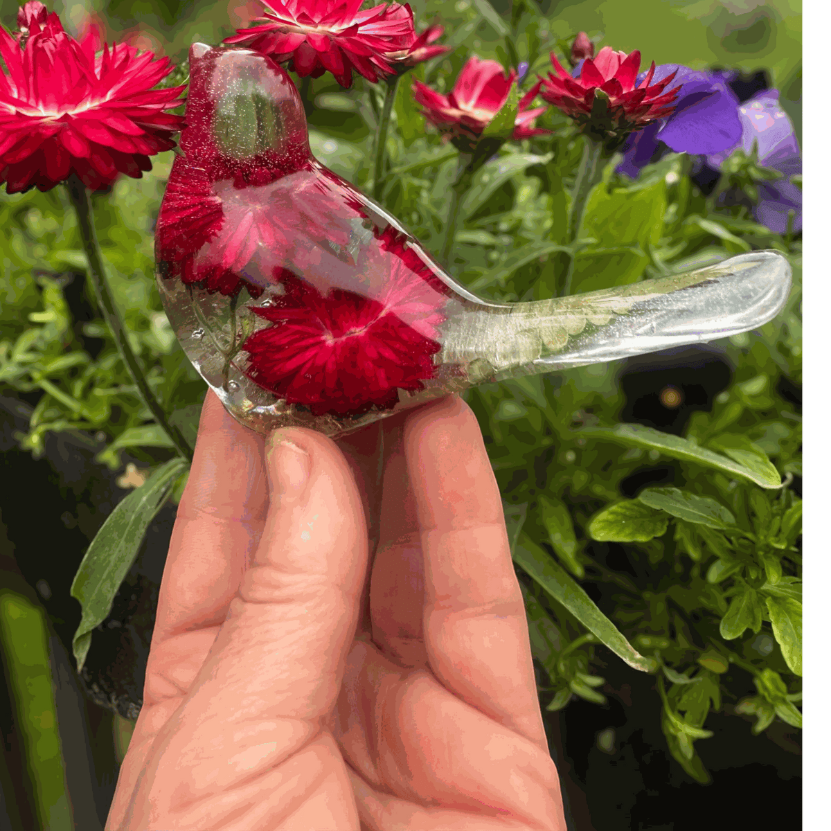Handmade Crimson Meadow Songbird resin decor with preserved deep pink strawflowers and green fern