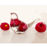 Handmade Crimson Meadow Songbird resin decor with preserved deep pink strawflowers and green fern