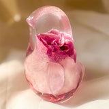 Pink rose resin bird decor featuring a preserved soft pink rose inside clear resin handcrafted songbird sculpture