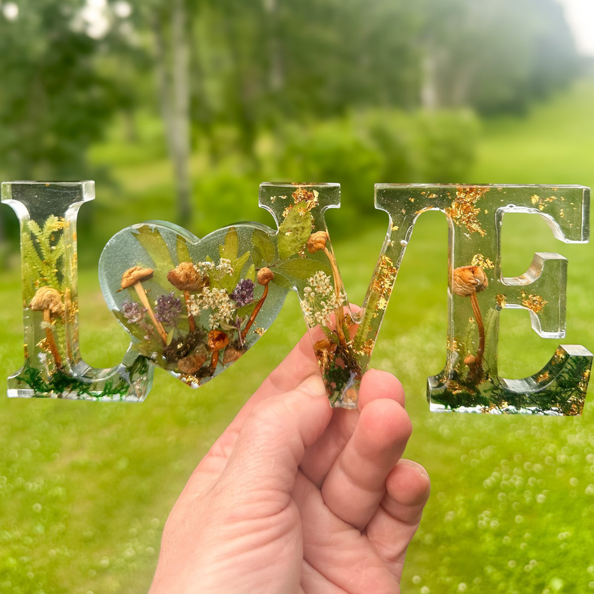 Boreal Mushroom LOVE resin word art with hand-foraged mushrooms, ferns, moss, and gold leaf accents