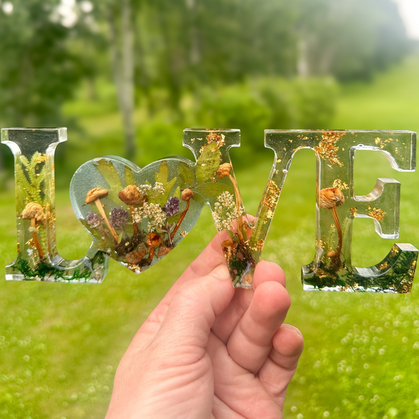 Boreal Mushroom LOVE resin word art with hand-foraged mushrooms, ferns, moss, and gold leaf accents
