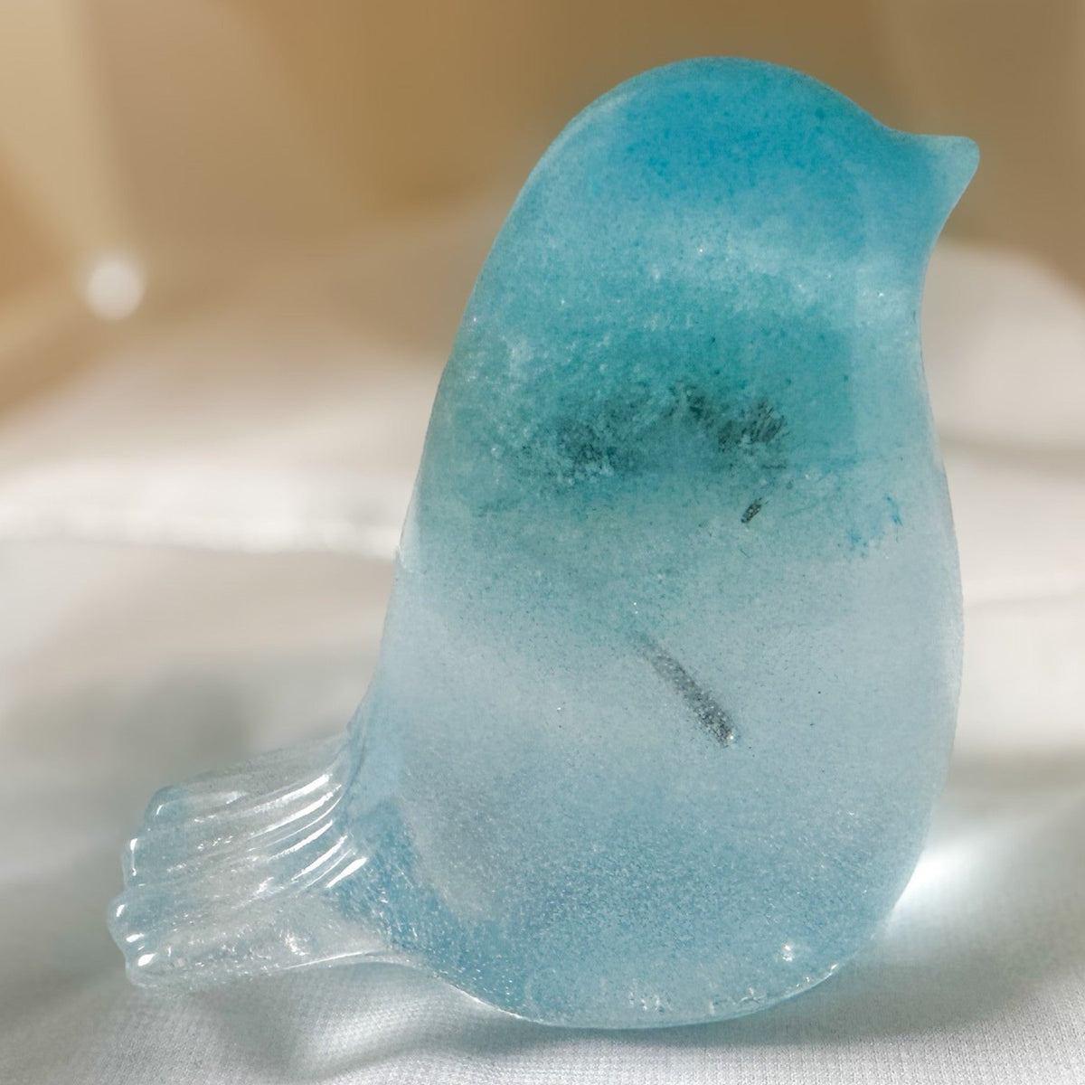 Handmade glow in the dark resin bird decor with real preserved dandelion puff inside glowing blue resin