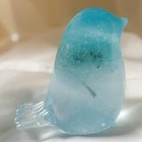 Handmade glow in the dark resin bird decor with real preserved dandelion puff inside glowing blue resin