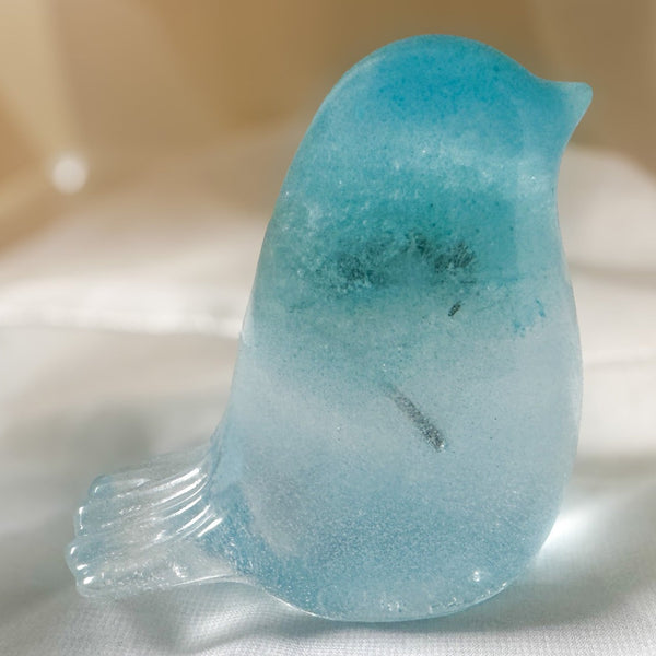 Handmade glow in the dark resin bird decor with real preserved dandelion puff inside glowing blue resin