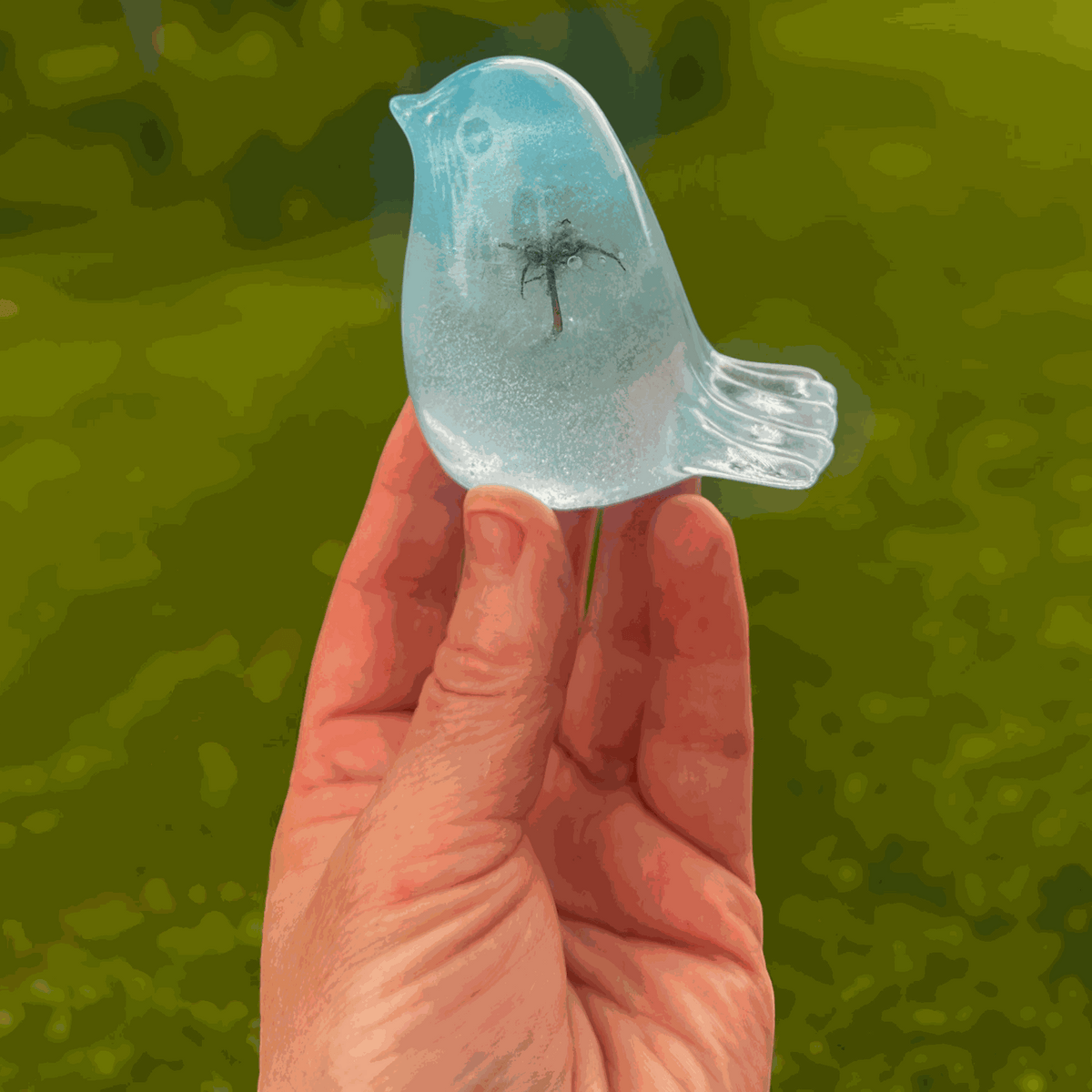 Handmade glow in the dark resin bird decor with real dandelion puff inside glowing blue resin