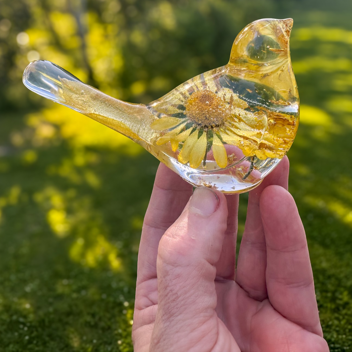 Handcrafted yellow floral daisy resin bird with gold leaf details and real summer blooms