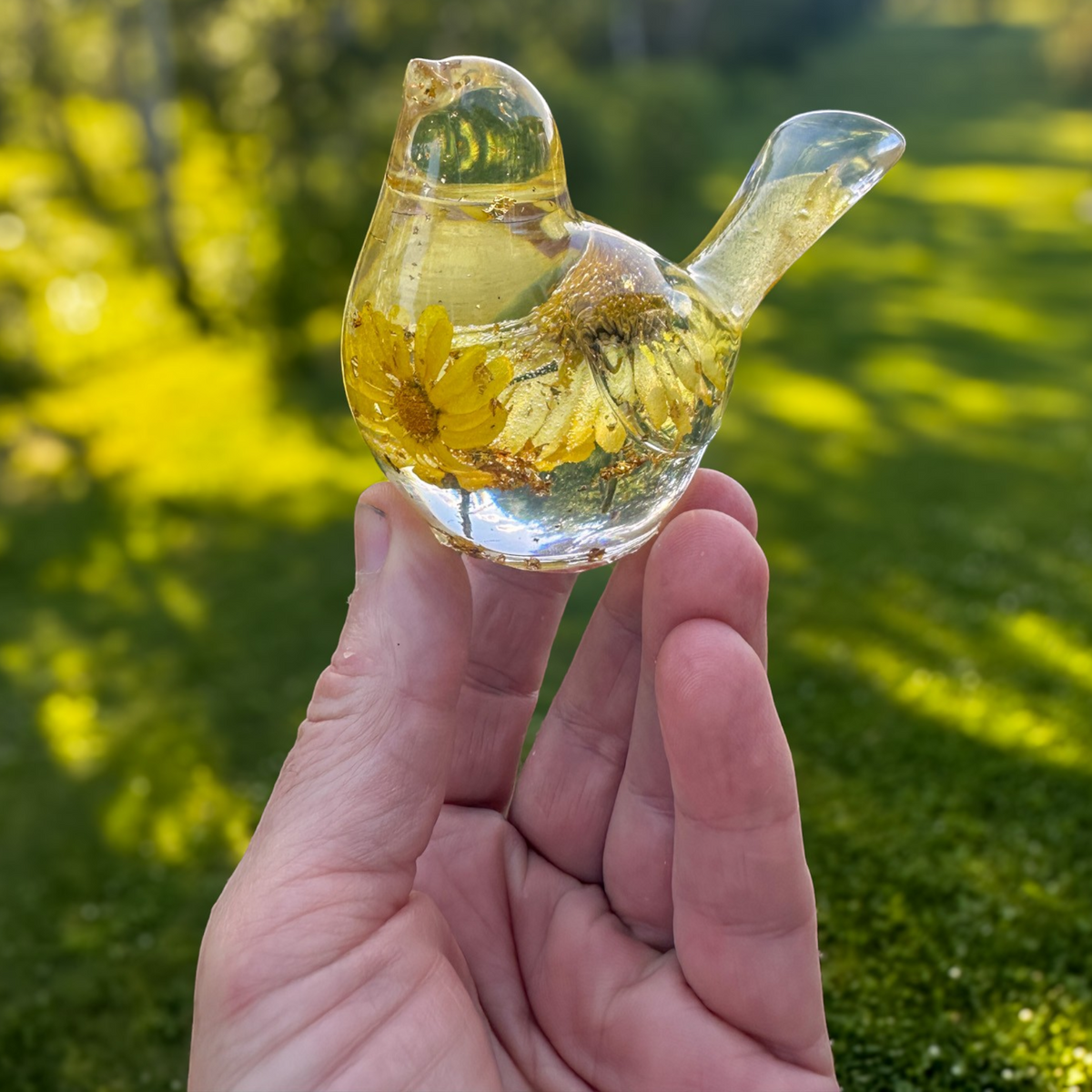 Handcrafted resin bird with real yellow floral daisy and gold leaf details