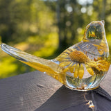 Handcrafted yellow floral daisy resin bird with gold leaf accents and real summer blooms