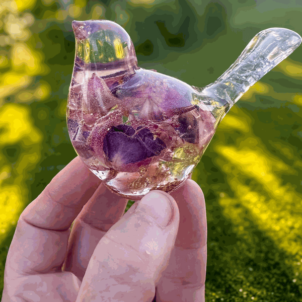 Handmade clear resin bird with real preserved fuchsia flowers and gold leaf accents