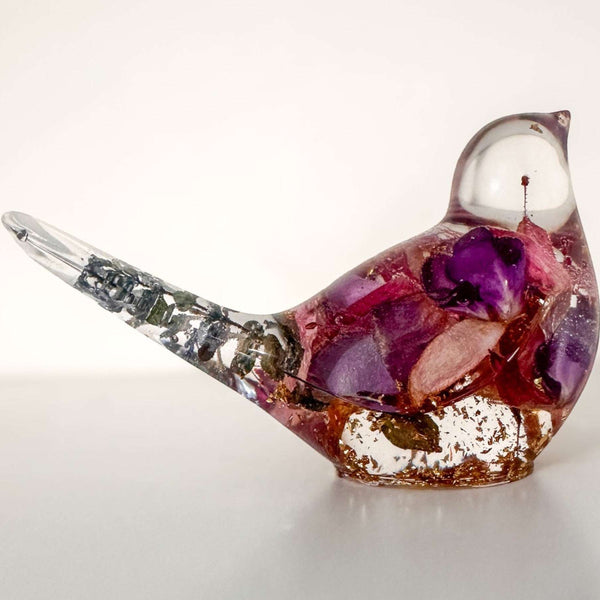 Handmade clear resin bird filled with real preserved fuchsia flowers and gold leaf accents