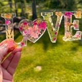 Fuchsia Garden LOVE resin word art with real pink and fuchsia flowers, fern fronds, and gold leaf flakes