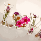 Wildflower resin word art with pink daisies, white daisy, purple wildflowers, rose buds, and gold leaf flakes in LOVE letters