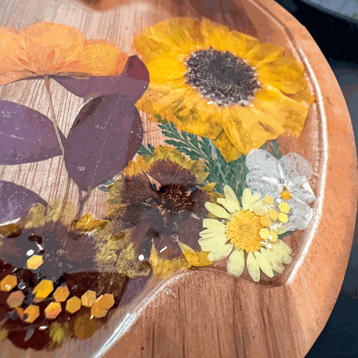 Wooden Harvest Sunflower Pumpkin Tray with pressed sunflower, dried botanicals, bee charm, and gold glitter seal in resin