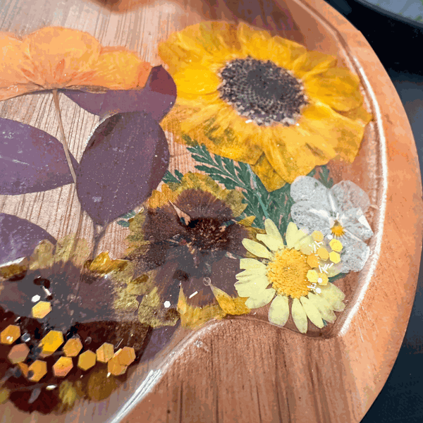 Wooden Harvest Sunflower Pumpkin Tray with pressed sunflower, dried botanicals, bee charm, and gold glitter seal in resin