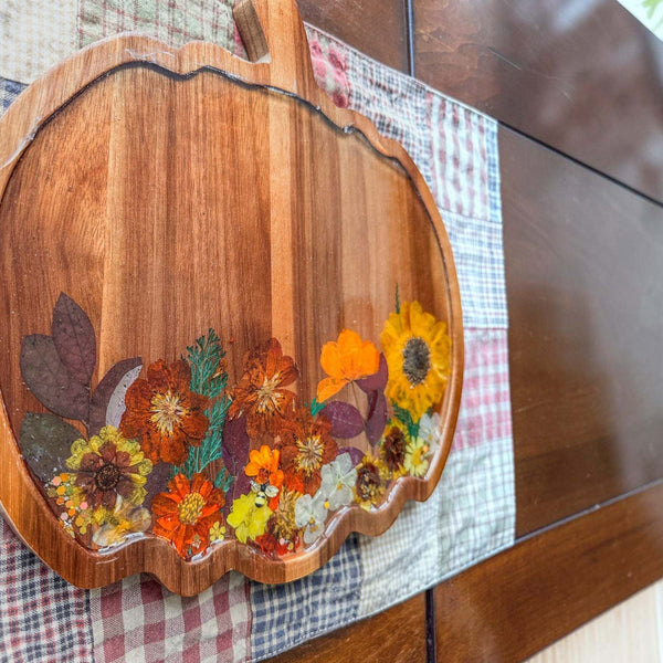 Wooden Harvest Sunflower Pumpkin Tray with pressed sunflower, bee charm, dried botanicals, and gold glitter sealed in resin