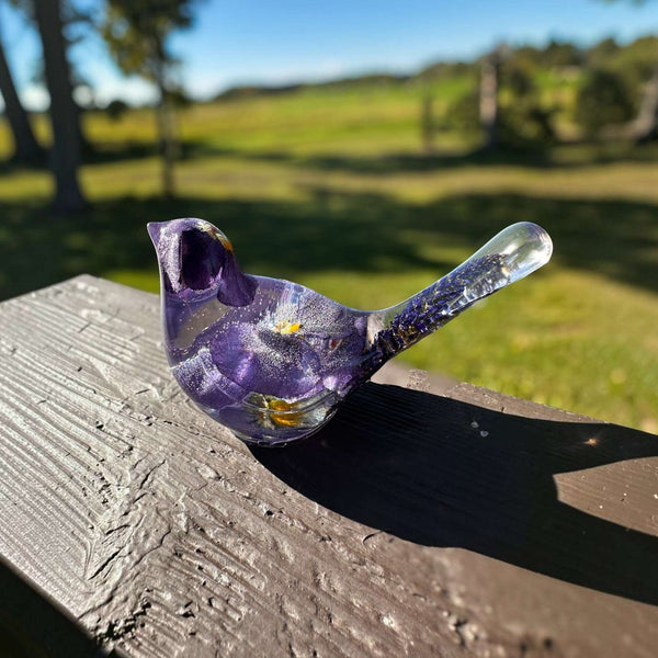 Handmade clear resin Purple Pansy bird decor with real pressed purple pansies and purple sage in the tail.