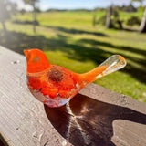 Orange sunflower resin bird decor with bright orange petals, clear resin tail, and embedded flower details in vibrant hues