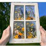 Pressed Flower Window Frame with white distressed wood, four resin panes featuring real dried wildflowers, dragonflies, and a butterfly.