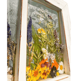 Pressed Flower Window Frame with white distressed wood, clear resin panes featuring real dried yellow, orange, purple flowers and green foliage with dragonflies and butterfly accents.