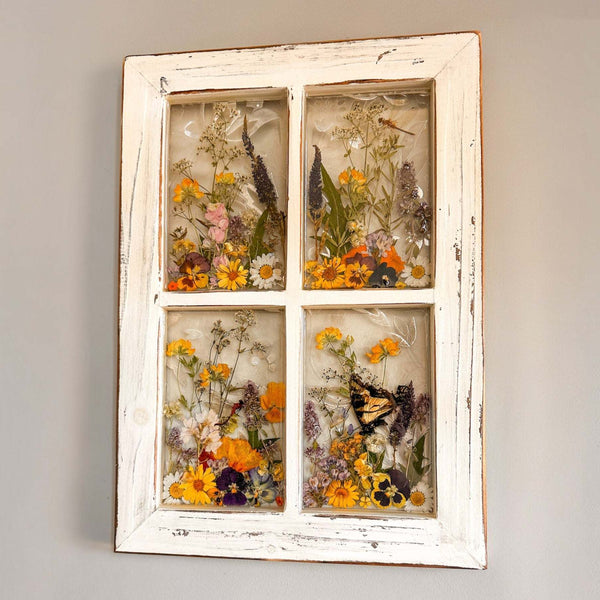 Pressed Flower Window Frame with real dried yellow, orange, purple wildflowers and butterflies set in clear resin within a distressed white wood window frame.