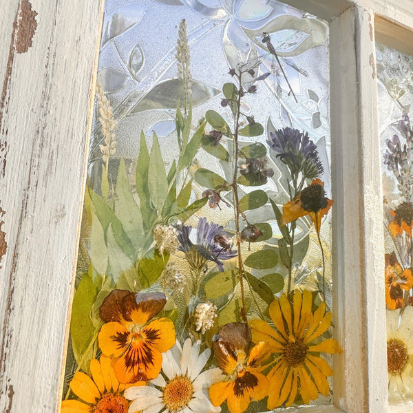 Pressed Flower Window Frame with soft white distressed wood, clear resin panes holding real dried yellow, white, and purple wildflowers and greenery