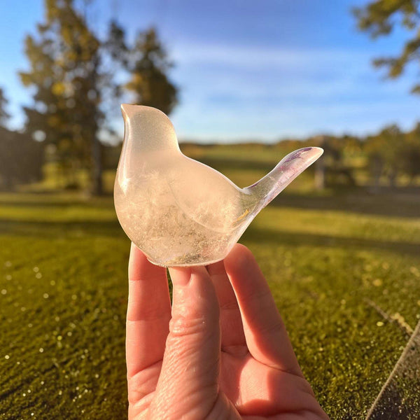 Glow in the Dark Resin Bird, translucent milky white with subtle violet glitter and a sculpted tail

