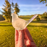 Glow in the Dark Resin Bird, translucent milky white with violet glitter and a raised tail silhouette