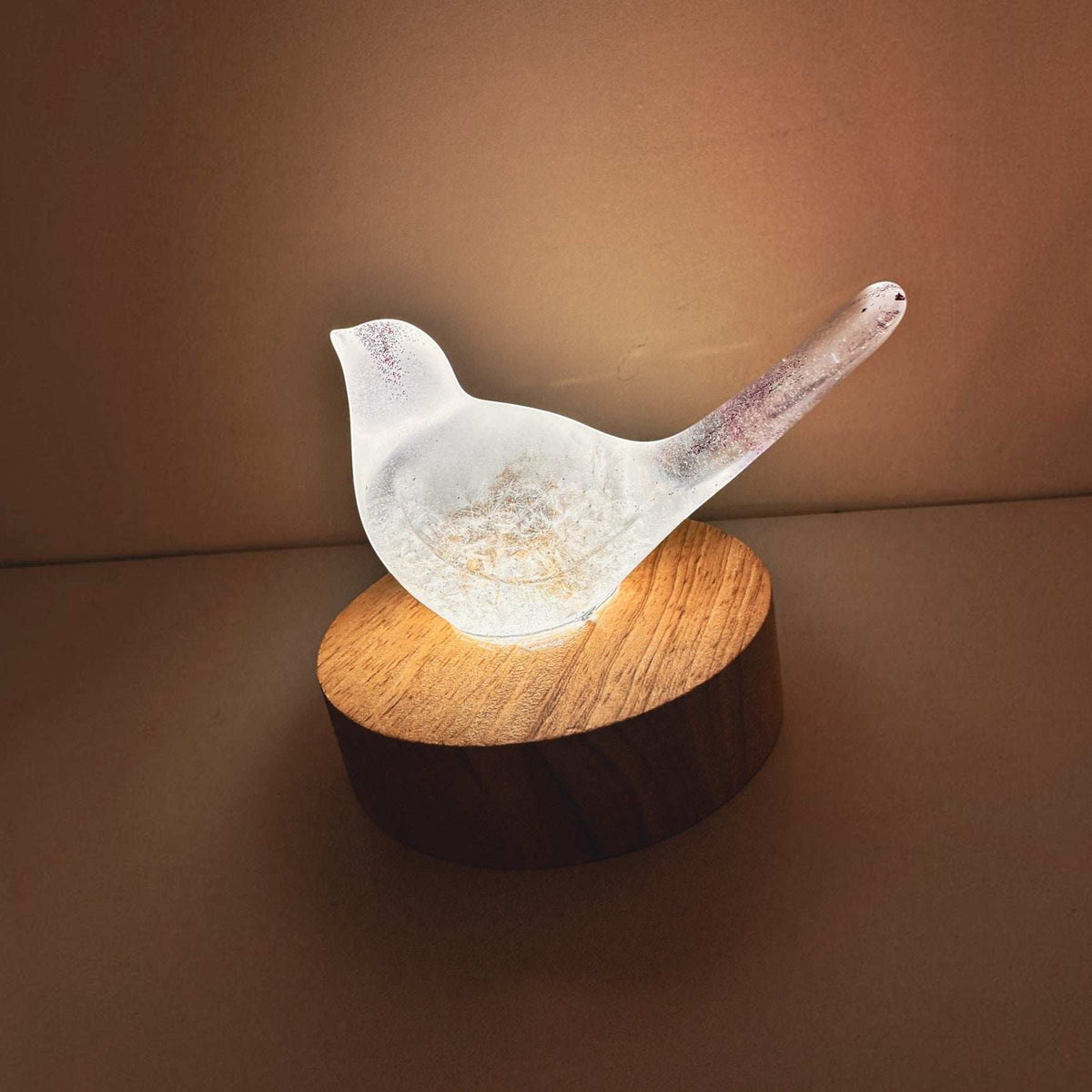 Glow in the Dark Resin Bird, milky white with violet glitter, real dandelion puff and wooden LED light base