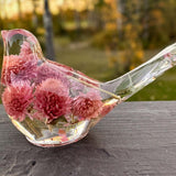 Dried flower resin bird with clear resin body and rosy pink dried clover blossoms, featuring a long tail