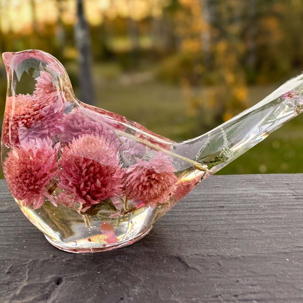 Dried flower resin bird with clear resin body and rosy pink dried clover blossoms, featuring a long tail