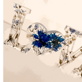 Forget me not resin love sign in clear resin, featuring blue pressed flowers, greenery and a heart-shaped O