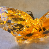 Light up resin butterfly decor with amber LED glow, clear resin, pressed flowers, gold leaf and black accents