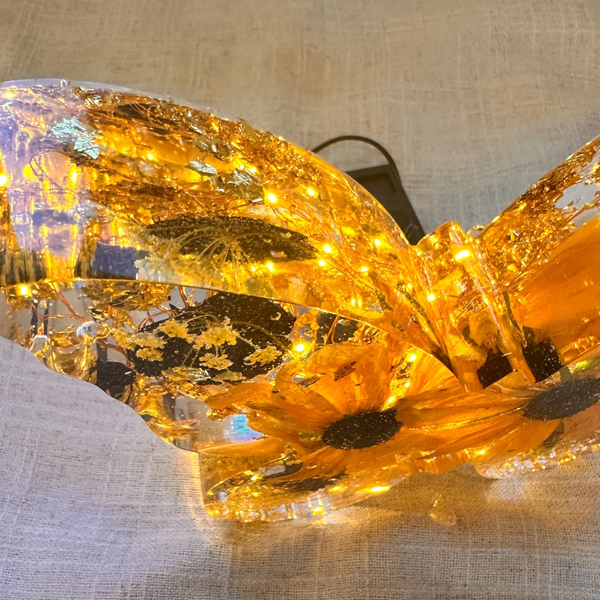 Light up resin butterfly decor with amber LED glow, clear resin, pressed flowers, gold leaf and black accents