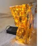 Light up resin butterfly decor with amber glow, clear resin, pressed botanicals and shimmering gold leaf details
