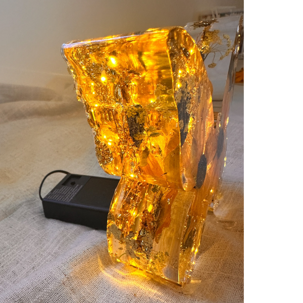 Light up resin butterfly decor with amber glow, clear resin, pressed botanicals and shimmering gold leaf details