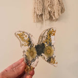 Light up resin butterfly decor, clear resin with pressed yellow flowers, black blooms and gold botanical accents