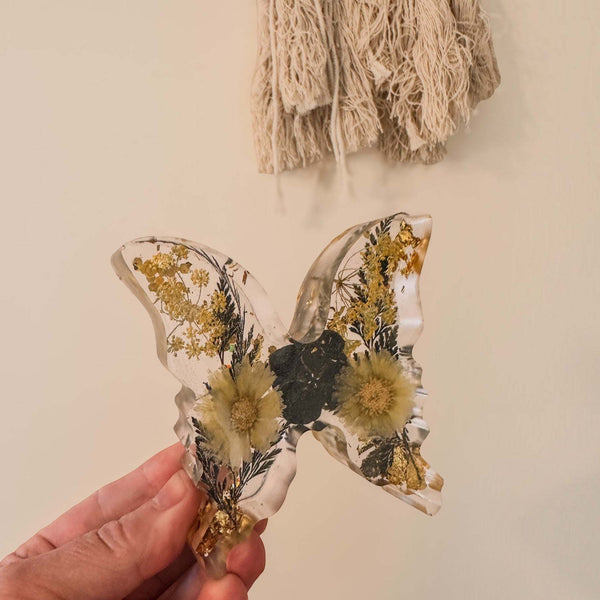 Light up resin butterfly decor, clear resin with pressed yellow flowers, black blooms and gold botanical accents