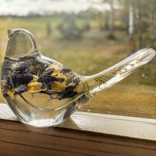 Blue Lupine resin bird decor in clear resin, with dark blue and golden dried flowers and green tail botanicals.