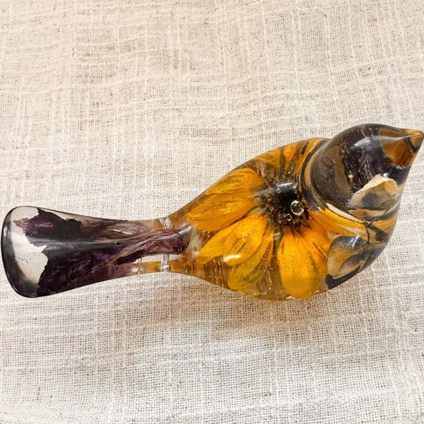 Sunflower lupine resin bird decor in clear resin with amber petals, dark purple flowers, and a glossy sculpted shape.