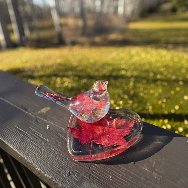 Maple leaf bird and tray set in clear glossy resin, featuring red maple leaves and gold flecks in a heart-shaped tray and bird.