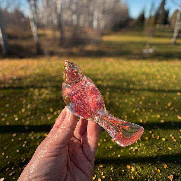 Maple leaf bird and tray set in clear glossy resin, with red dried maple leaves and gold flecks; bird-shaped ornament visible.