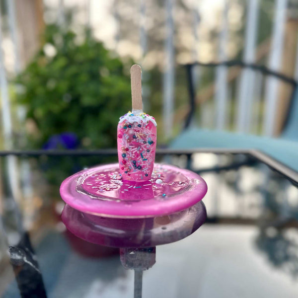 Popsicle Melting Pop Art Resin Sculpture Trinket Dish- Pretty in PinkA pink resin melting popsicle pop art sitting in a pink glass dish